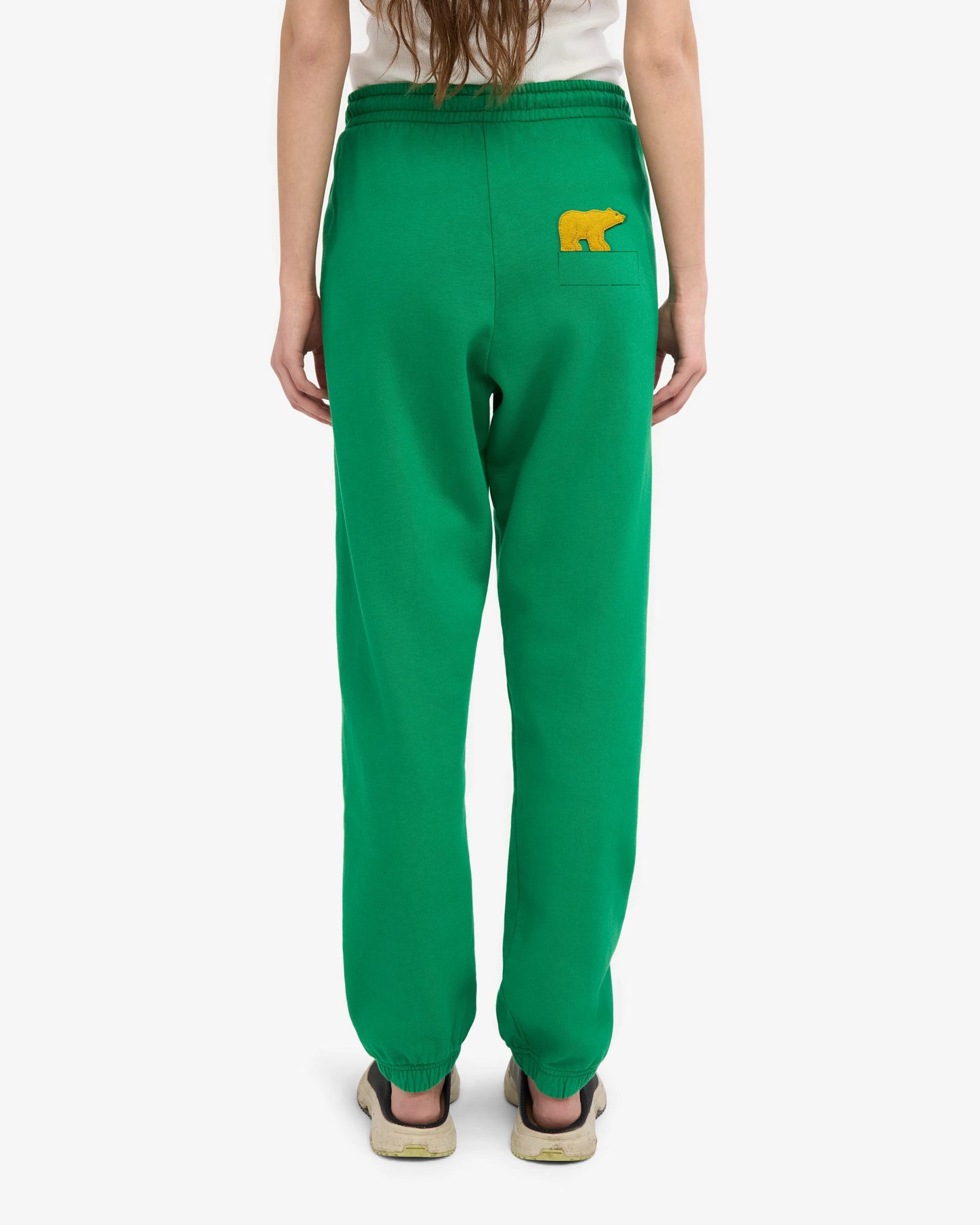 Back view of kelly green French terry joggers with an oversized Golden Bear chenille patch on the pocket