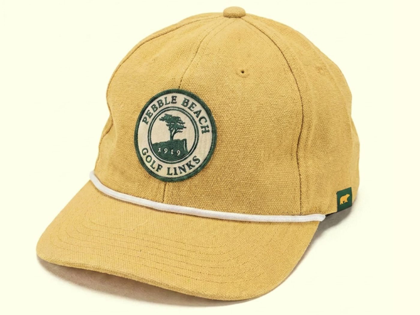 Golden khaki canvas rope cap with an embroidered Pebble Beach Golf Links crest